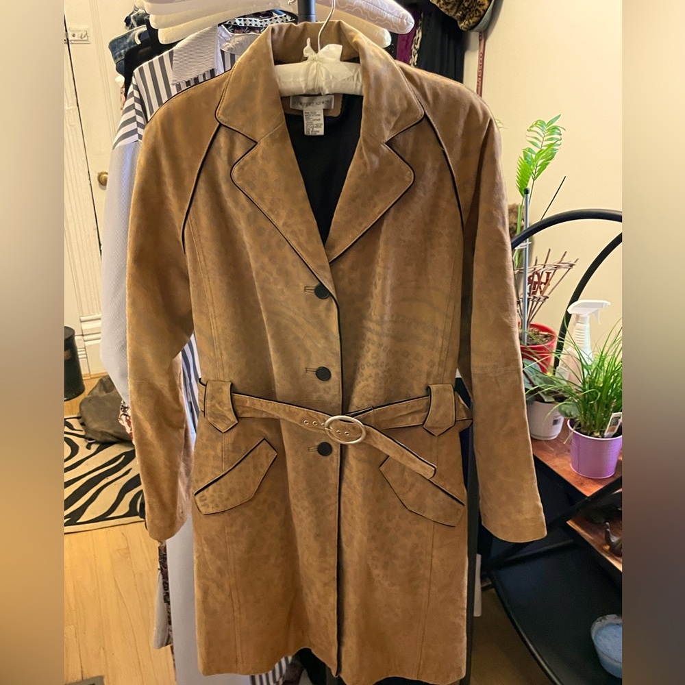 Leather trench style coat with animal print motif.